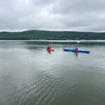 two kayakers on Canadarago Lake