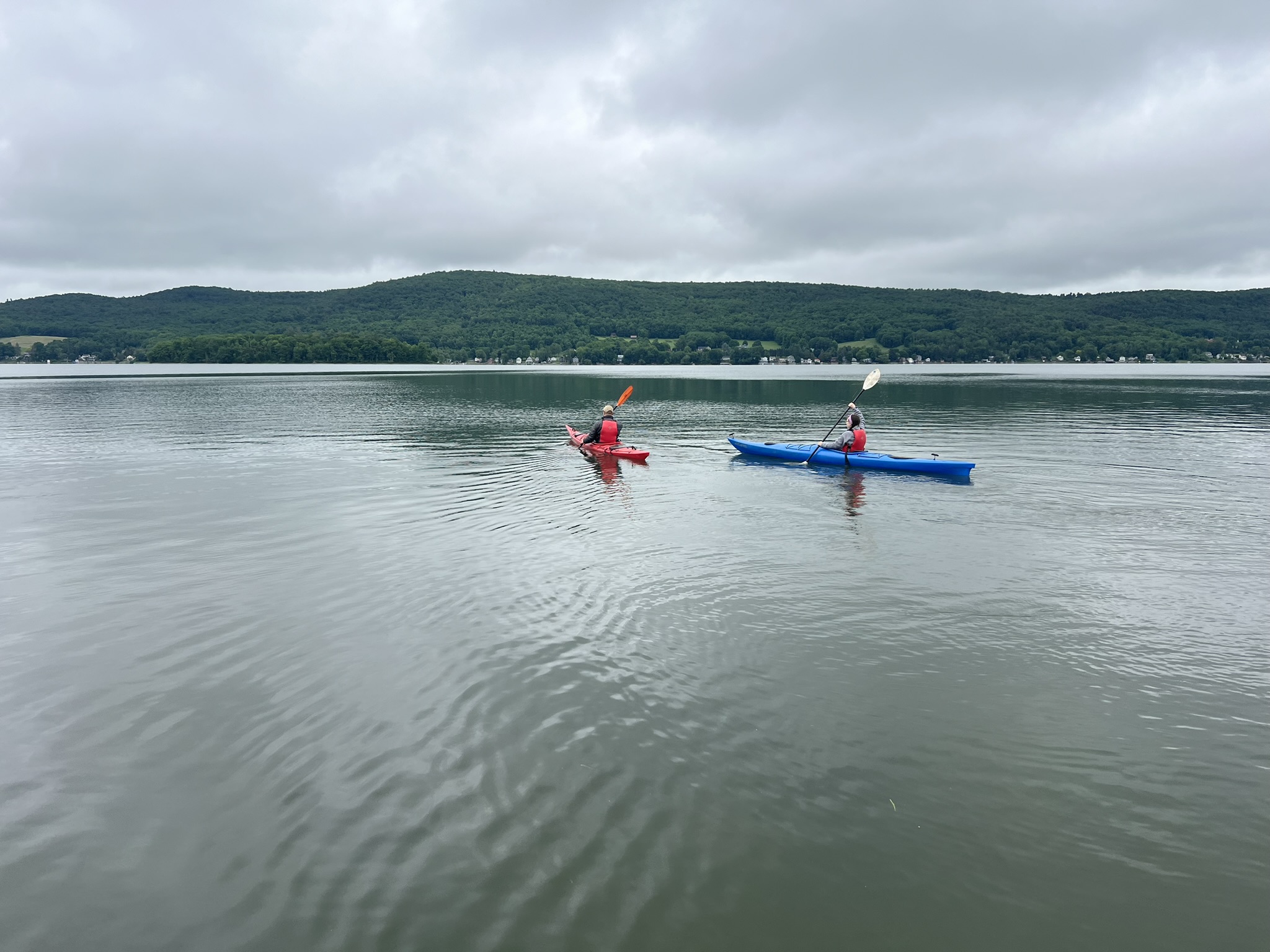 two kayakers on Canadarago Lake