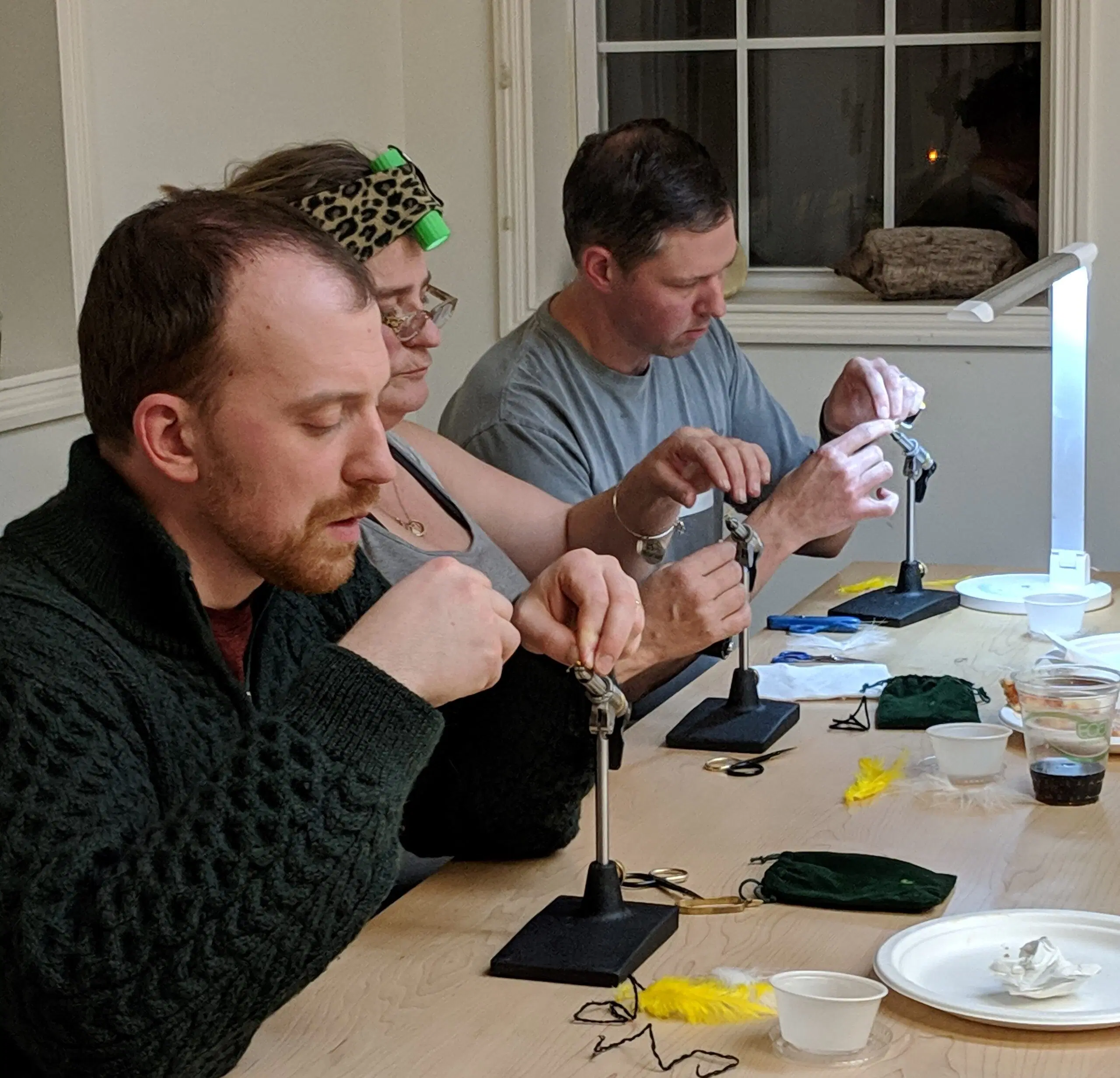 Participants at a fly tying activity