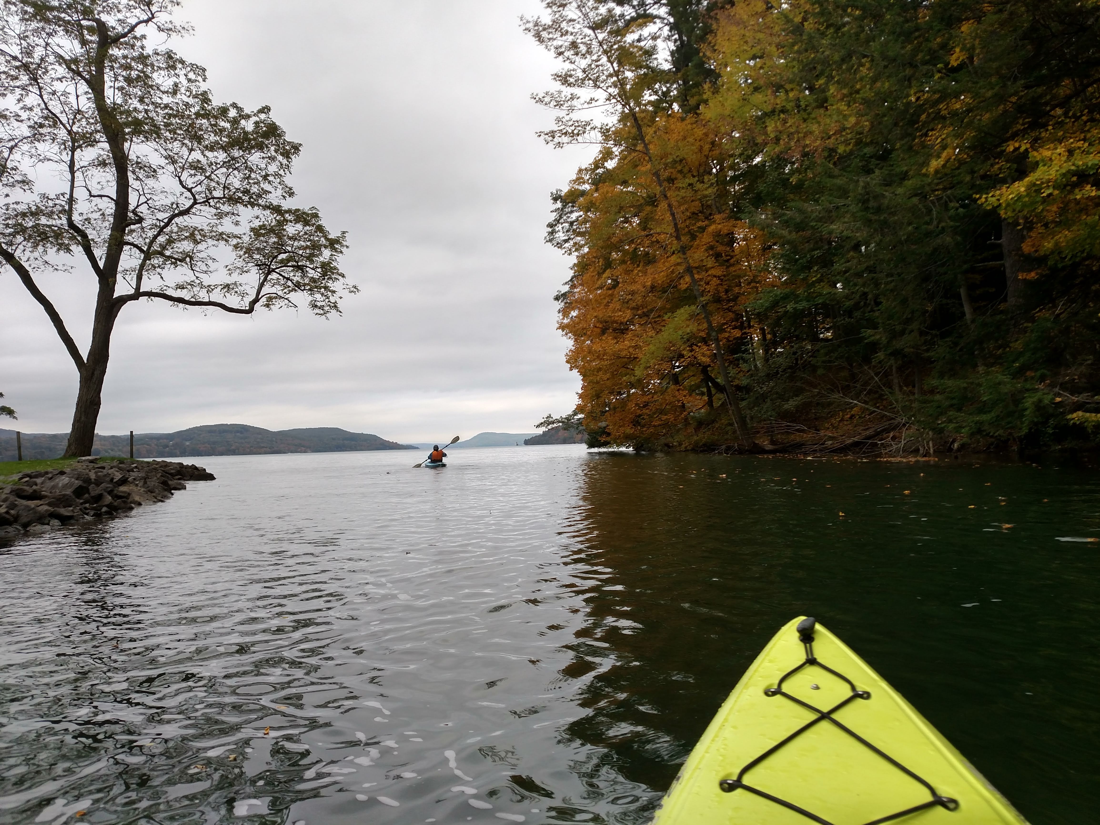 kayak and fall leaves on lake