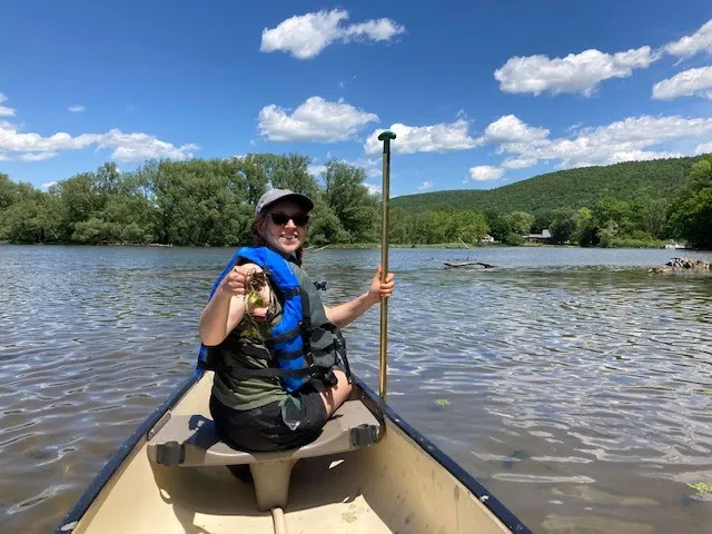 Woman on canoe on a lake
