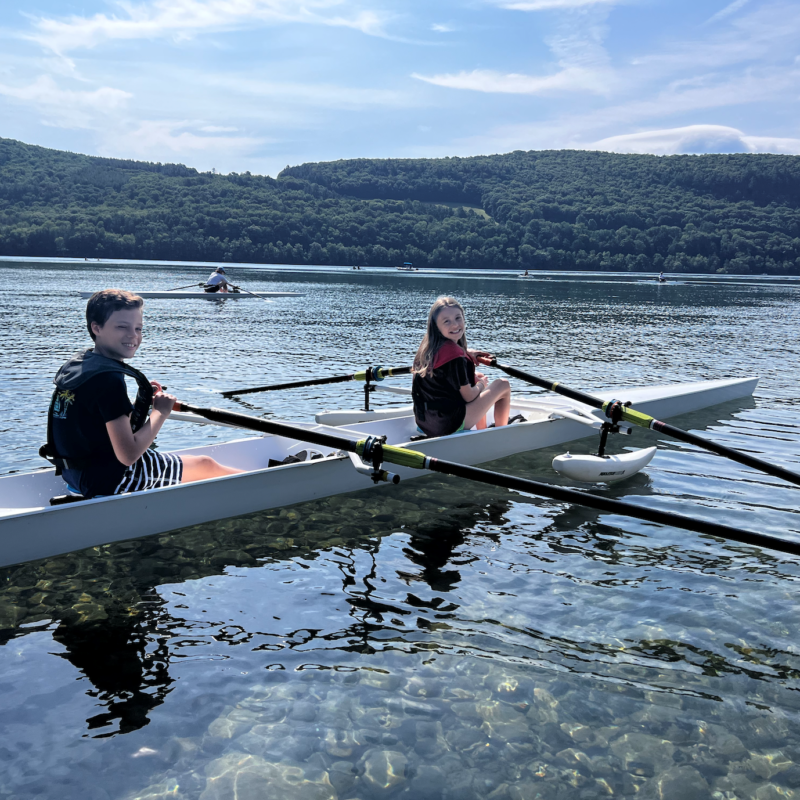 children rowing on Otsego Lake