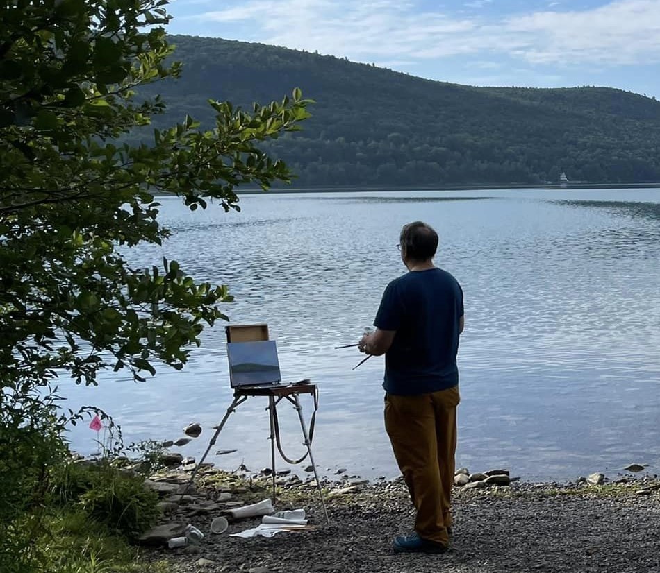 man painting lake scene at Brookwood Point