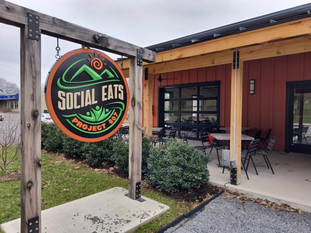 Social Eats sign and covered patio seating