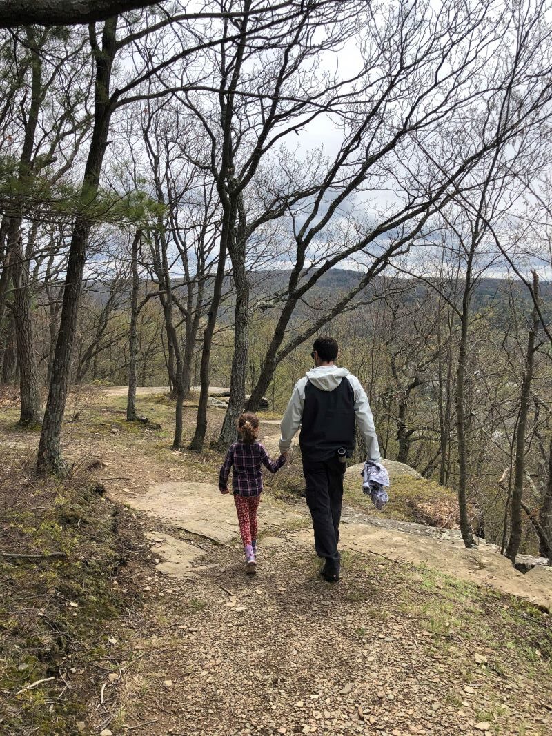 A man and his daughter hiking on the Table Rock trail
