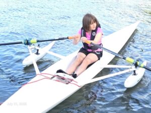 Girl rowing on a lak